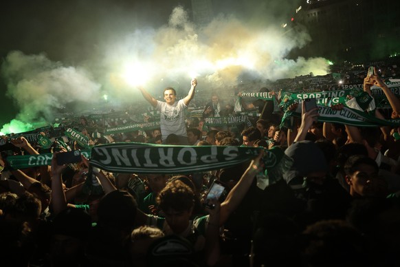 epa11320859 Sporting soccer fans celebrate the conquest of the Portuguese Soccer First League title at Marquis of Pombal Square in Lisbon, Portugal, 06 May 2024. Sporting became Portuguese soccer cham ...