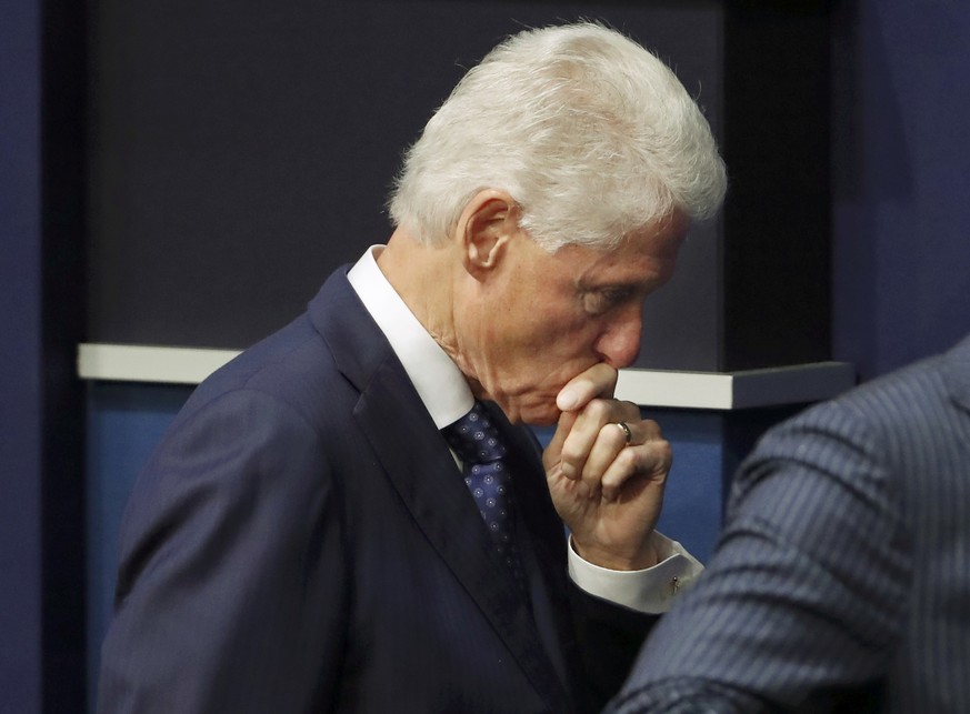 Former President Bill Clinton walks off stage after the presidential town hall debate between Republican U.S. presidential nominee Donald Trump and Democratic U.S. presidential nominee Hillary Clinton ...