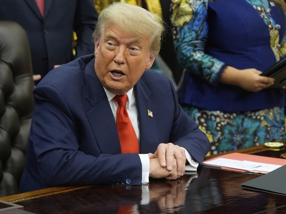 President Donald Trump answers questions from reporters as he meets with Congo&#039;s Foreign Minister Therese Kayikwamba Wagner, and Rwanda&#039;s Foreign Minister Olivier Nduhungirehe, Friday, June  ...