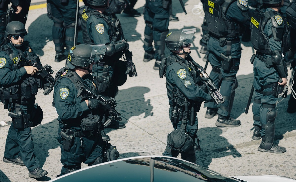 Iranian-American Protester at Uprising Rally in Los Angeles, USA - 8 Jun 2025 Law enforcement officers in tactical gear gather on the 101 freeway during an anti-ICE protest in downtown Los Angeles Dem ...