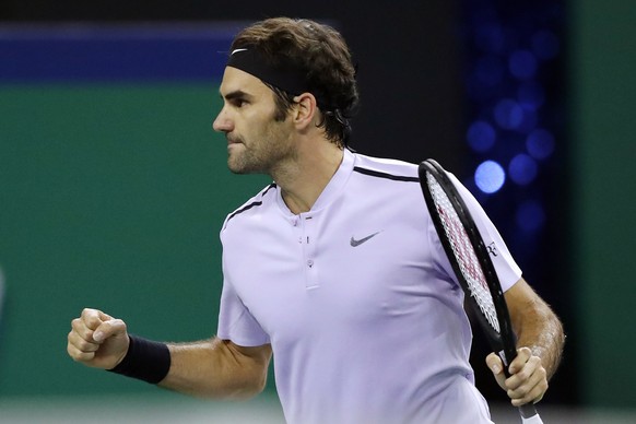 Roger Federer of Switzerland celebrates after defeating Juan Martin del Potro of Argentina in their men&#039;s semifinals match in the Shanghai Masters tennis tournament at Qizhong Forest Sports City  ...