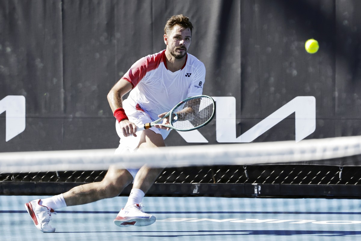 epa11823057 Stan Wawrinka of Switzerland in action against Lorenzo Sonego of Italy during their first round Men's Singles match at the Australian Open tennis tournament in Melbourne, Australia, 1 ...