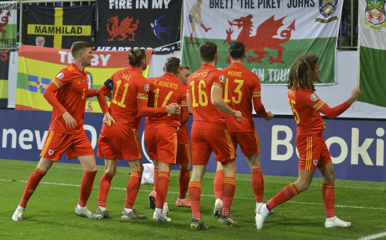 Wales&#039; players celebrate after scoring the opening goal during the Euro 2020 group E qualifying soccer match between Wales and Azerbaijan at the Olympic stadium in Baku, Azerbaijan, Saturday Nov. ...