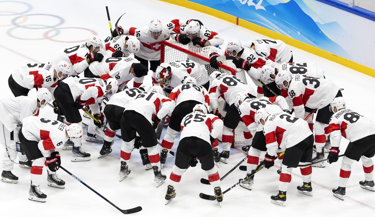 Switzerland's players huddle prior the men's ice hockey preliminary round game between Czech Republic and Switzerland at the National Indoor Stadium at the 2022 Winter Olympics in Beijing, C ...