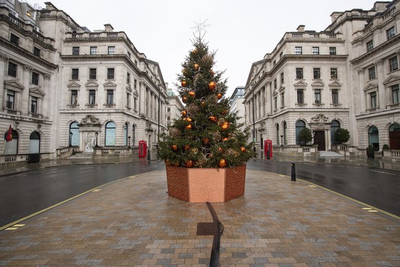 A quiet Lower Regent Street, in London on Monday Dec. 21, 2020. Millions of people in England have learned they must cancel their Christmas get-togethers and holiday shopping trips. British Prime Mini ...