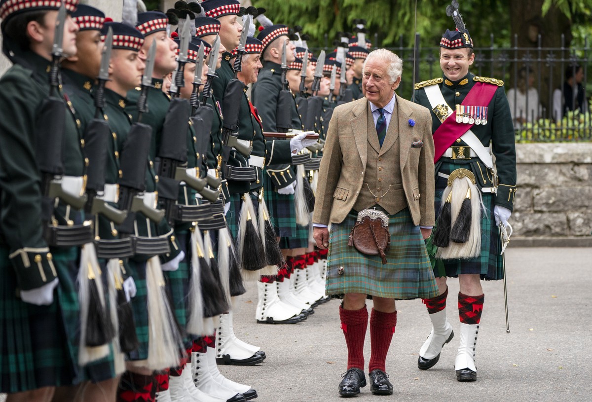 Britain's King Charles III inspects Balaklava Company, 5th Battalion, The Royal Regiment of Scotland, at the gates of Balmoral, Scotland, Monday Aug. 21, 2023, as he takes up summer residence at  ...