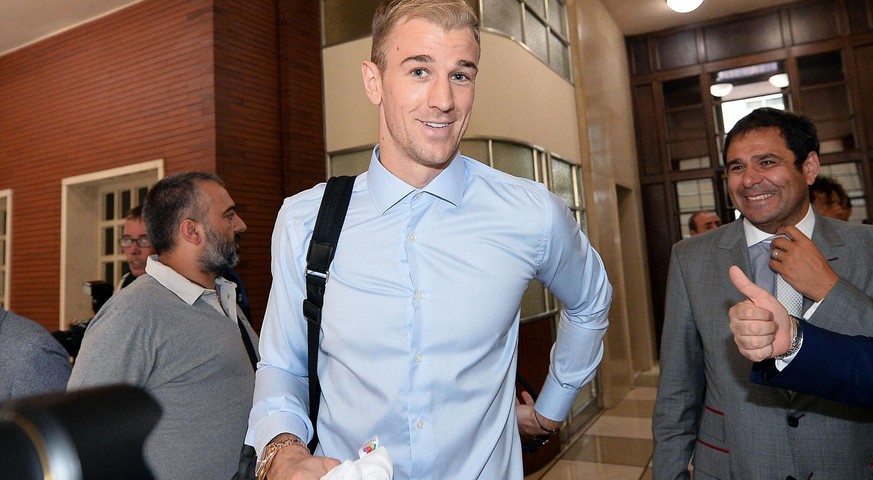 Goalkeeper Joe Hart smiles upon his arrival at the Torino soccer team headquarters in Turin, Italy, Tuesday, Aug. 30, 2016. England goalkeeper Joe Hart is on the verge of completing a loan move to Tor ...