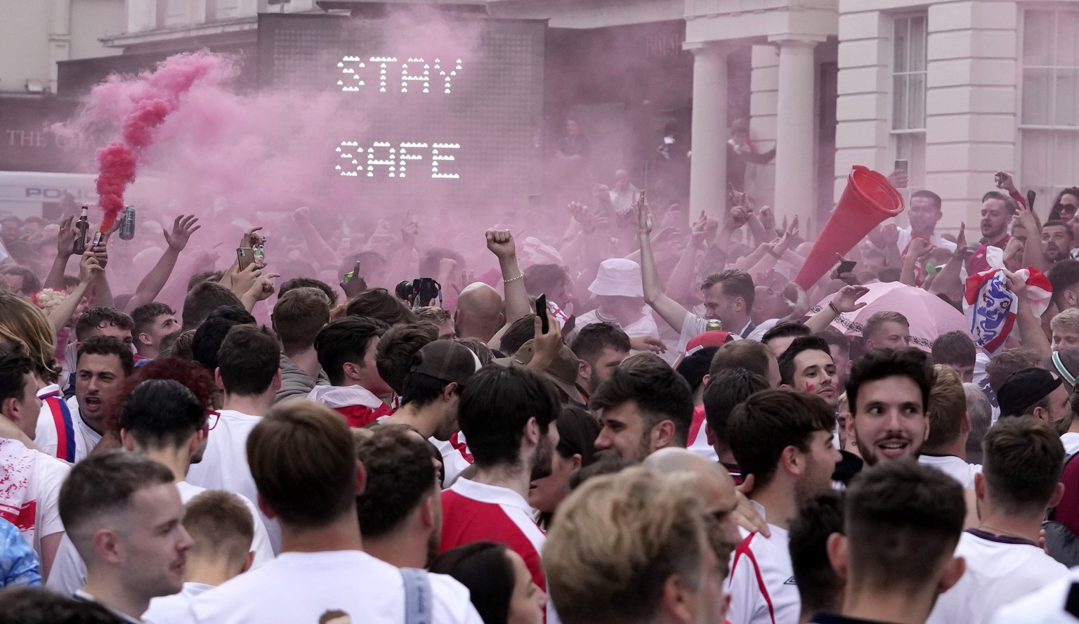 England fans cheer at St Martin-in-the-Fields near Trafalgar Square in London, Sunday, July 11, 2021, prior to the Euro 2020 soccer championship final match between England and Italy which is being pl ...