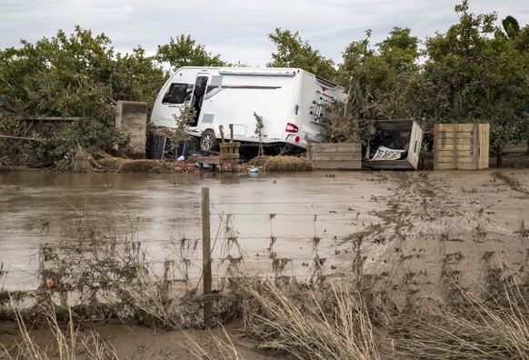 A recreation vehicle is piled on debris and surrounded by floodwater in Hawkes Bay, New Zealand, Friday, Feb. 17, 2023. Cyclone Gabrielle struck the country&#039;s north on Monday and has brought more ...