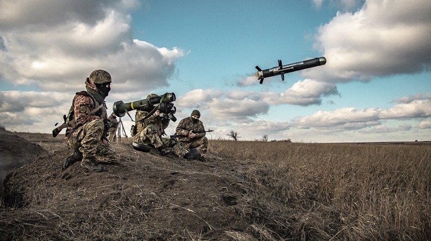 In this image released by Ukrainian Defense Ministry Press Service, Ukrainian soldiers use a launcher with US Javelin missiles during military exercises in Donetsk region, Ukraine, Thursday, Dec. 23,  ...