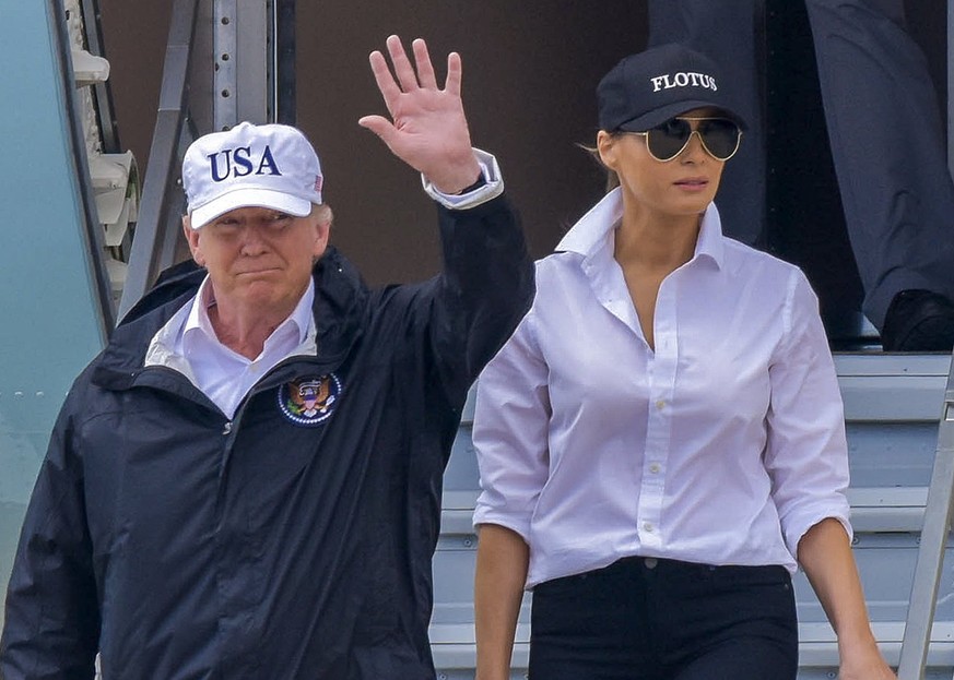 epa06170695 US President Donald J. Trump (L) and First Lady Melania Trump step off Air Force One after arriving in Corpus Christi, Texas, USA, 29 August 2017. Trump is getting an update on the relief  ...