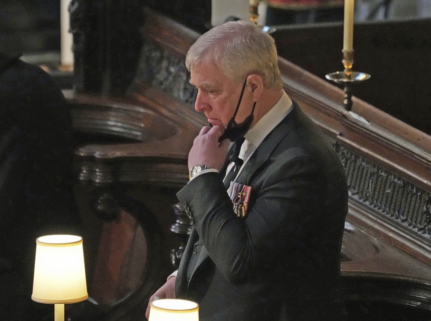 FILE - Britain&#039;s Prince Andrew stands inside St. George&#039;s Chapel during the funeral of his father, Prince Philip, at Windsor Castle, Windsor, England, Saturday April 17, 2021. Longtime Jeffr ...