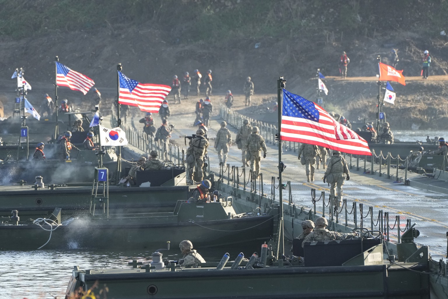 Flags of South Korea and the United States flutter before a joint river-crossing drill between South Korea and the United States in Yeoju, South Korea, Friday, Oct. 20, 2023. (AP Photo/Ahn Young-joon)