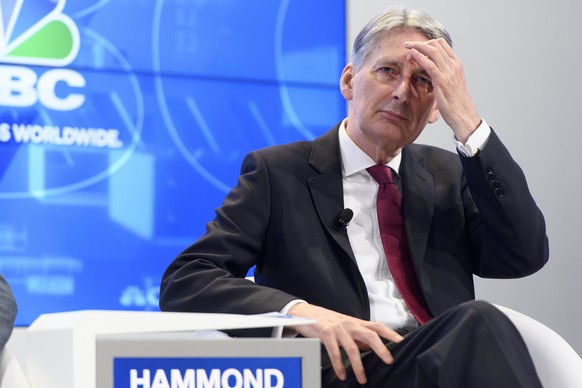 epa06473389 British Chancellor of the Exchequer Philip Hammond speaks during a panel session during the 48th Annual Meeting of the World Economic Forum, WEF, in Davos, Switzerland, 25 January 2018. Th ...