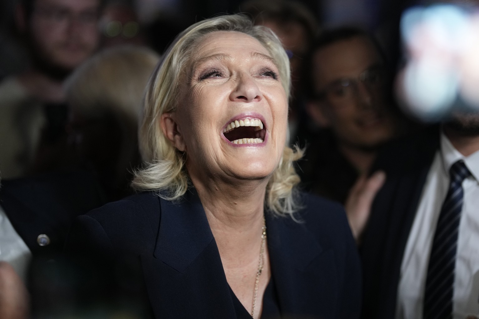 French far right leader Marine Le Pen reacts as she meets supporters and journalists after the release of projections based on the actual vote count in select constituencies , Sunday, June 30, 2024 in ...