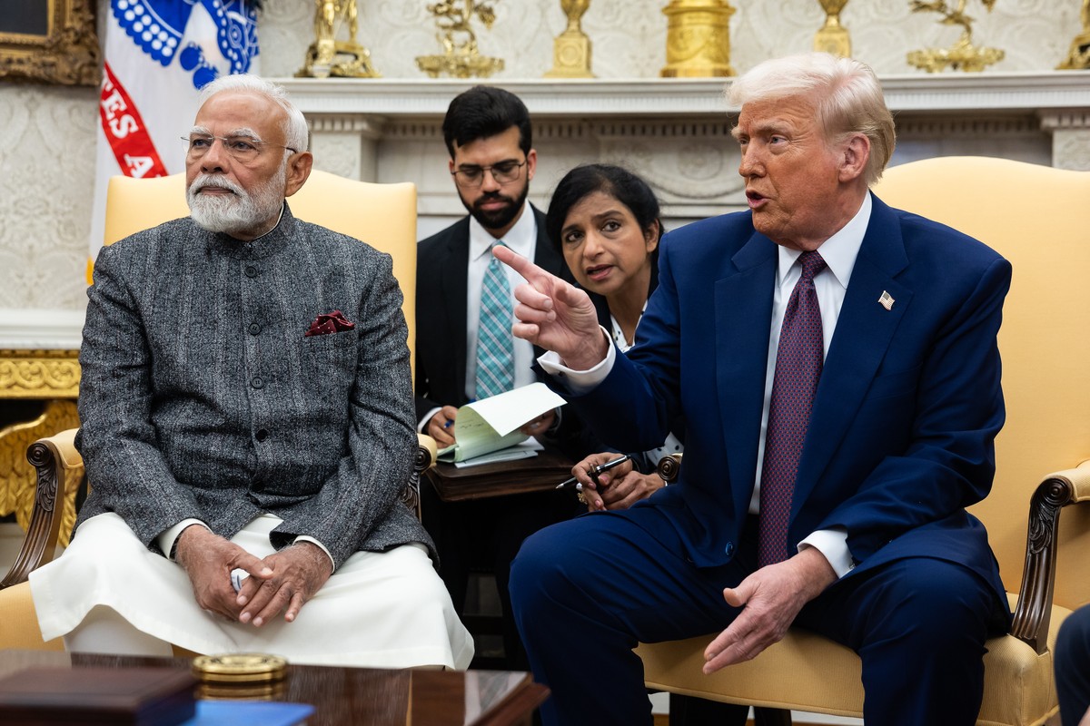 epa11894516 India Prime Minister Narendra Modi (L) and US President Donald Trump (R) speak with reporters in the Oval Office at the White House in Washington, DC, USA, 13 February 2025. EPA/FRANCIS CH ...