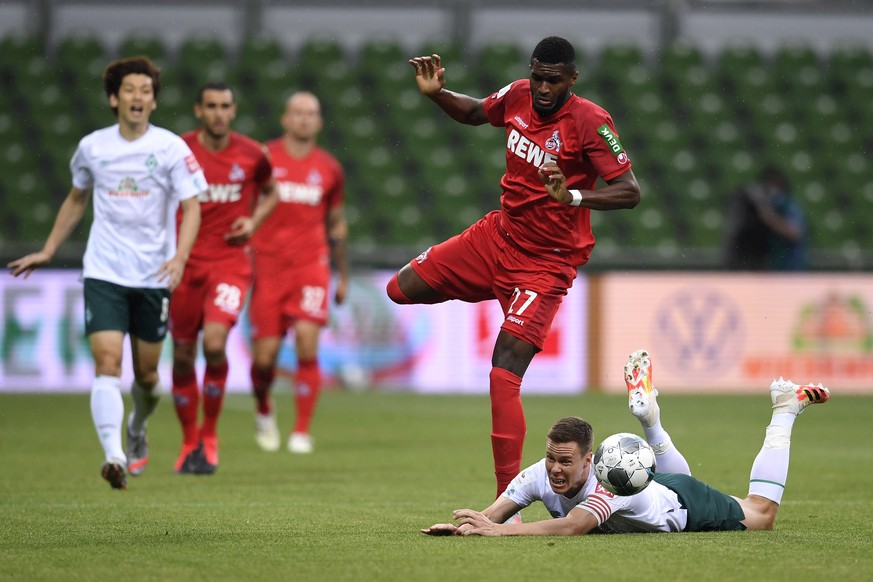 epa08511969 Anthony Modeste (L) of FC Koln battles for the ball with Niklas Moisander of Werder Bremen during the German Bundesliga soccer match between SV Werder Bremen and 1. FC Koeln at Wohninvest  ...