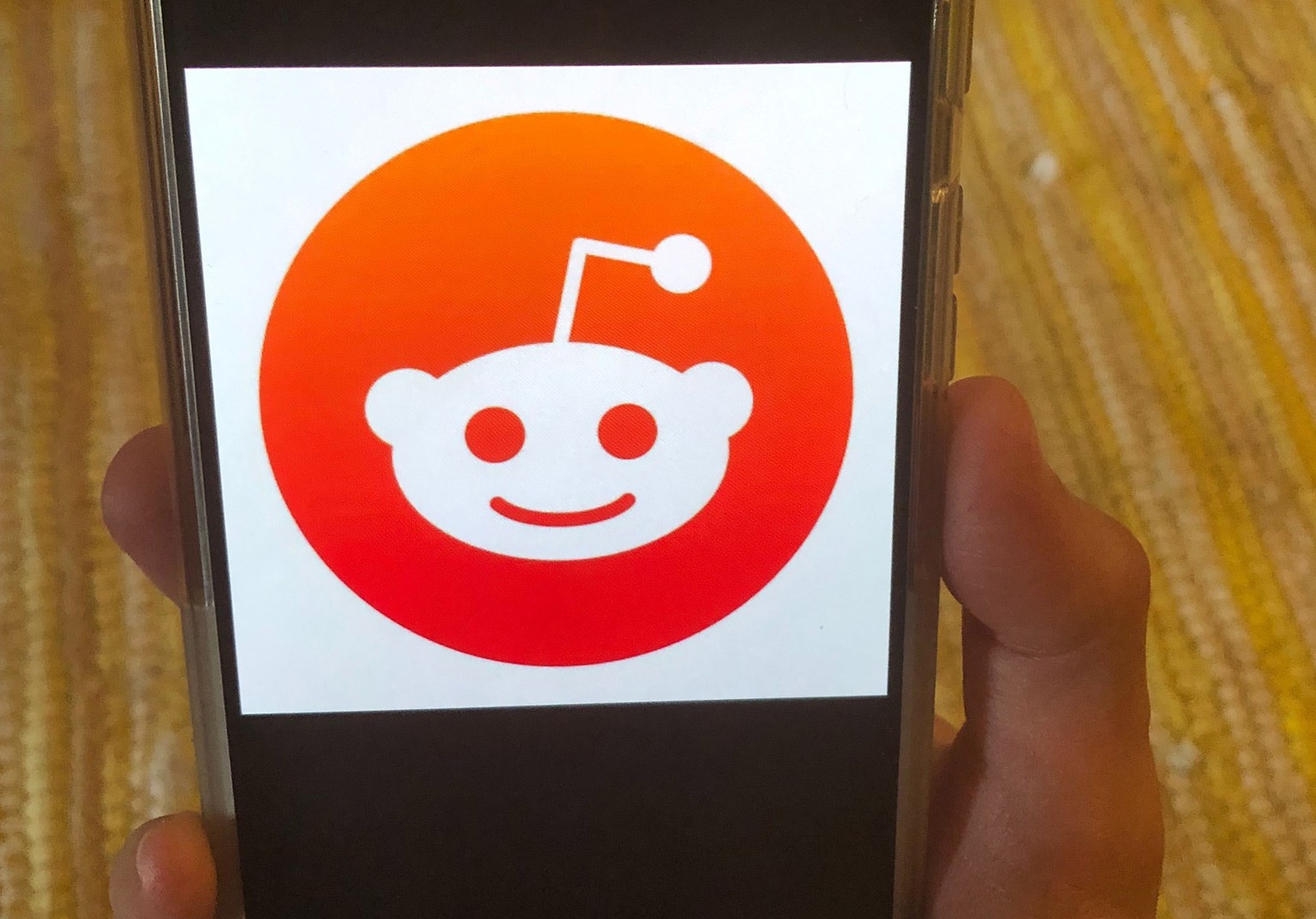 FILE - This June 29, 2020 file photo shows the Reddit logo on a mobile device in New York. Reddit struck a deal with Google that allows the search giant to use posts from the online discussion site fo ...