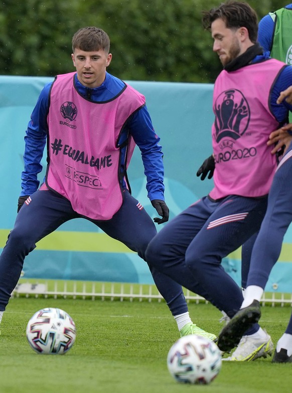 England&#039;s Mason Mount, third left, and England&#039;s Ben Chilwell, fourth left, during a team training session at Tottenham Hotspur training ground in London, Monday, June 21, 2021 one day ahead ...