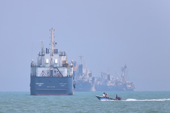 A small motorboat passes anchored vessels in the Strait of Hormuz off Bandar Abbas, Iran, Thursday, June 11, 2026.(Amirhosein Khorgooi/ISNA via AP)
Iran War Strait of Hormuz