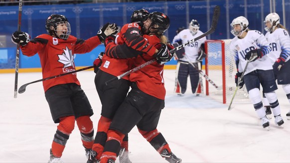 epa06526866 Canada players (L) celebrate a goal against the USA during a preliminary Women&#039;s Ice Hockey match between USA and Canada at the Kwandong Hockey Centre during the PyeongChang Winter Ol ...