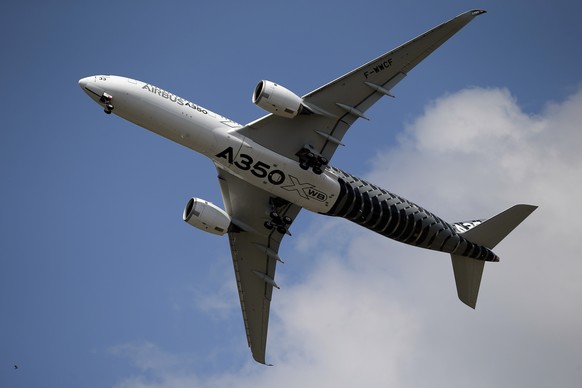 FILE - In this June 17, 2015 file photo, an Airbus A350 performs a demonstration flight at the Paris Air Show, in Le Bourget airport, north of Paris. European planemaker Airbus says it is taking the l ...