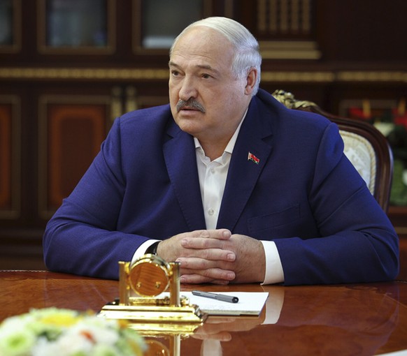 epa12369437 A handout photo made available by the Belarusian Presidential Press Service shows Belarus President Alexander Lukashenko (R) speaks with US Presidential envoy John Coale (L) during their m ...