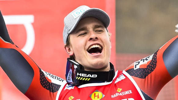 Winner Atle Lie McGrath of Norway celebrates on the podium ceremony after the second run of the men&#039;s Slalom race at the FIS Alpine Skiing World Cup finals in Meribel, France, Sunday, March 20, 2 ...