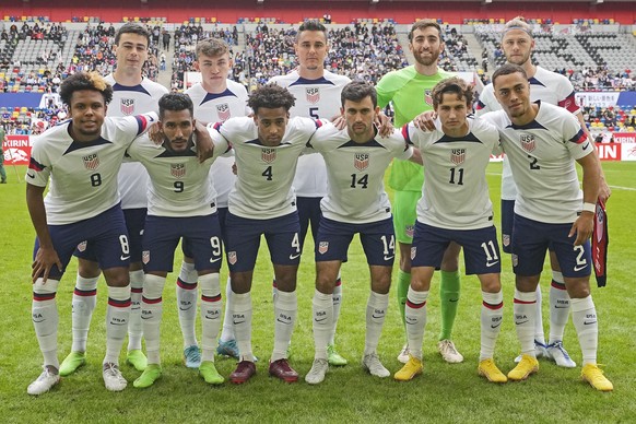 Team USA stands for the team picture prior the international friendly soccer match between USA and Japan as part of the Kirin Challenge Cup in Duesseldorf, Germany, Friday, Sept. 23, 2022. (AP Photo/M ...