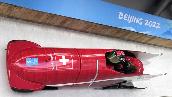 Martina Fontanive of Switzerland speeds down the track during a 2-woman bobsled training at the 2022 Winter Olympics, Tuesday, Feb. 15, 2022, in the Yanqing district of Beijing. (AP Photo/Mark Schiefe ...