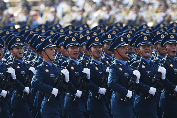 epa12347455 Chinese troops march during a military parade marking the 80th anniversary of the end of the Sino-Japanese War in Beijing, China, 03 September 2025. China holds on 03 September celebration ...