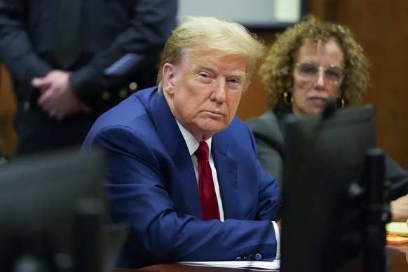 epa11242878 Former US President Donald Trump (L) awaits the start of a pre-trial hearing with his defense team in Manhattan criminal court in New York City, New York, USA, 25 March 2024. A judge will  ...