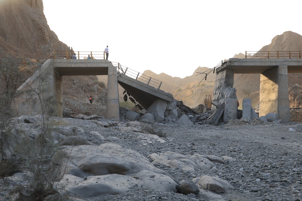 People stand on a bridge destroyed after a strike in Hormozgan province, southern Iran, Saturday, July 18, 2026. (Amirhosein Khorgooi/Iranian Students' News Agency via AP)
Iran War
