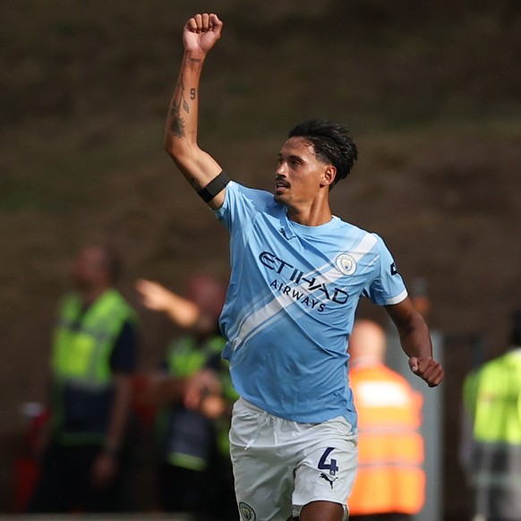 epa12305037 Tijjani Reijnders of Manchester City celebrates scoring the 0-2 goal during the English Premier League match between Wolverhampton Wolves and Manchester City, in Wolverhampton, Britain, 16 ...