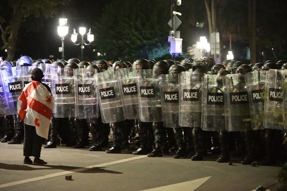 Police block protesters during an opposition rally in the city center of Tbilisi, Georgia, on Saturday, Oct. 4, 2025, boycotting the municipal elections and call for the release of political opponents ...