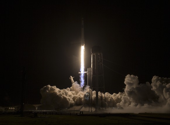 epa09575212 A handout photo made available by NASA showing a SpaceX Falcon 9 rocket carrying the company&#039;s Crew Dragon spacecraft is launched on NASA?s SpaceX Crew-3 mission to the International  ...