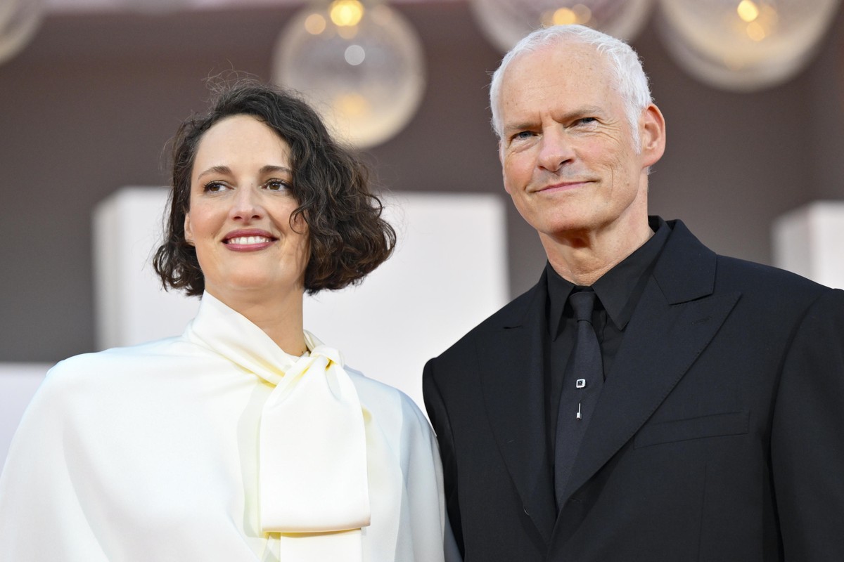 epa13209872 British-Irish director Martin McDonagh (R) and British actor Phoebe Waller-Bridge arrive for the premiere of 'Wild Horse Nine' at the 83rd annual Venice International Film Festiv ...