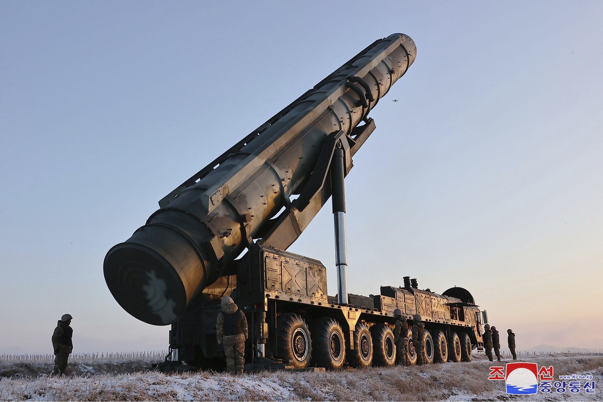 FILE - This undated photo provided Dec. 19, 2023, by the North Korean government shows what it says is an intercontinental ballistic missile (ICBM) being prepared to launch from an undisclosed locatio ...
