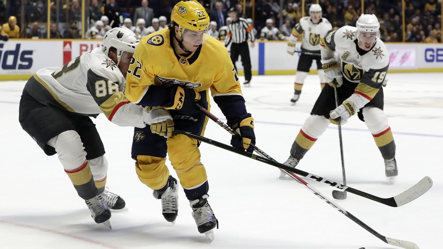 Nashville Predators left wing Kevin Fiala (22), of Switzerland, is defended by Vegas Golden Knights&#039; Nate Schmidt (88) in the second period of an NHL hockey game Tuesday, Jan. 16, 2018, in Nashvi ...