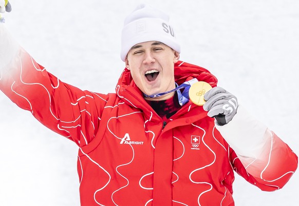 Gold medalist Franjo von Allmen of Switzerland celebrates on the podium after the men's alpine skiing Super-G race at the 2026 Olympic Winter Games at the Stelvio Ski centre in Bormio, Italy, on  ...