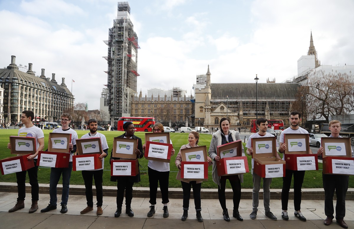 Activists from the People's Vote campaign show 'Deal or No Deal' boxes in London, Monday, Jan. 14, 2019. Britain's Prime Minister Theresa May is struggling to win support for her B ...
