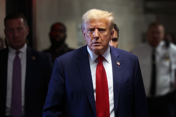 epa11301358 Former President Donald Trump speaks to the media at Manhattan Criminal during the continuation of his hush money trial, in New York, USA, 25 April 2024. Trump is facing 34 felony counts o ...