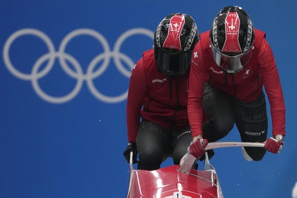 Melanie Hasler and Nadja Pasternack of Switzerland start during a 2-woman bobsled training at the 2022 Winter Olympics, Thursday, Feb. 17, 2022, in the Yanqing district of Beijing. (AP Photo/Pavel Gol ...