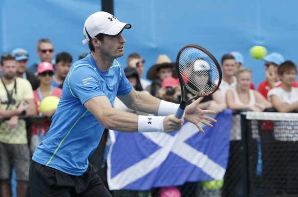 epa04594218 Fans with a Scottish flag watch Andy Murray of Britain during a practice session at the Australian Open Grand Slam tennis tournament in Melbourne, Australia, 30 January 2015. Murray will p ...