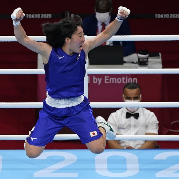 Japan&#039;s Sena Irie, right, celebrates defeating Philippines&#039;s Nesthy Petecio, left, to win the women&#039;s featherweight 60-kg final boxing match at the 2020 Summer Olympics, Tuesday, Aug. 3 ...