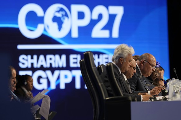 Sameh Shoukry, chair of the COP27 climate summit, right, speaks at a closing plenary session at the UN climate summit, Sunday, November 20, 2022, in Sharm el-Sheikh, Egypt.  (AP Photo/Peter Dejon...