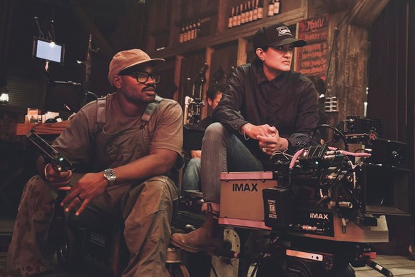 This image released by Warner Bros. Pictures shows director-writer-producer Ryan Coogler, left, and cinematographer Autumn Durald Arkapaw on the set of "Sinners." (Eli Adé/Warner Bros. Pictu ...