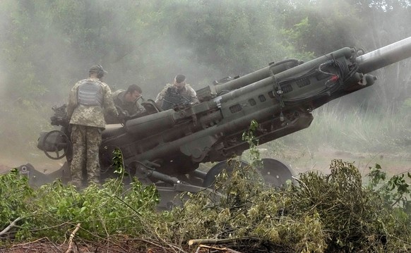 Ukrainian soldiers prepare to fire at Russian positions from a U.S.-supplied M777 howitzer in Ukraine&#039;s eastern Donetsk region Saturday, June 18, 2022. (AP Photo/Efrem Lukatsky)