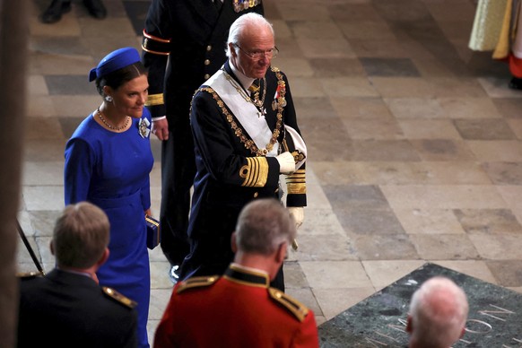 Sweden&#039;s King Carl XVI Gustaf and Crown Princess Victoria of Sweden arrive to attend Britain&#039;s King Charles III and Queen Consort Camilla&#039;s coronation ceremony, at Westminster Abbey, in ...