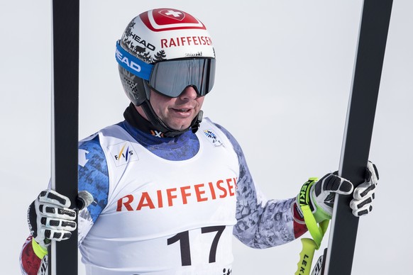 Beat Feuz of Switzerland stands in the finish area during the men&#039;s downhill training at the 2017 Alpine Skiing World Championships in St. Moritz, Switzerland, Thursday, Feb. 9, 2017. (Alexandra  ...